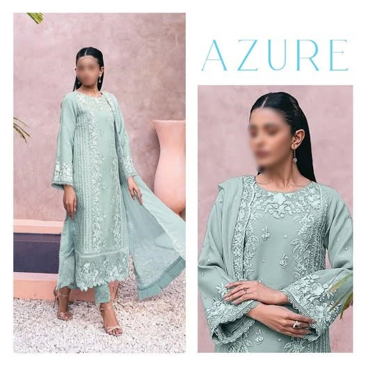 Woman wearing a light blue embroidered outfit with 'Azure' branding on a pink background